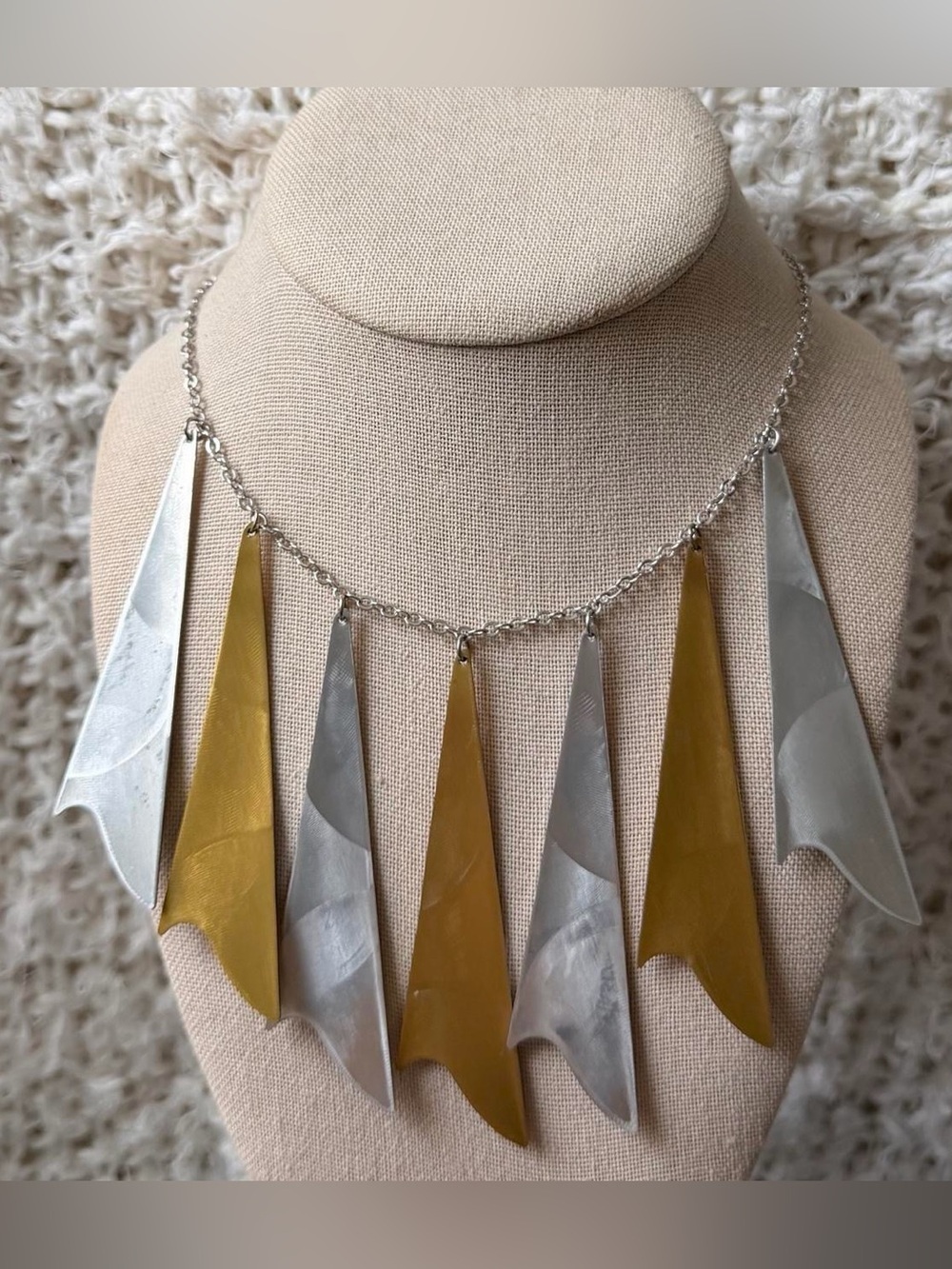 silver and gold metallic fringe necklace with alternating triangular pendants